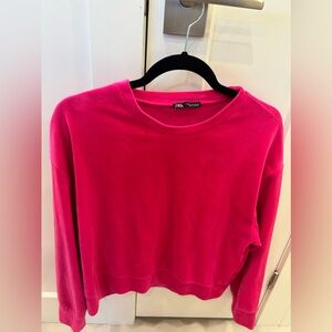 Hot pink long sleeve velvet sweater. Cinched long sleeves.